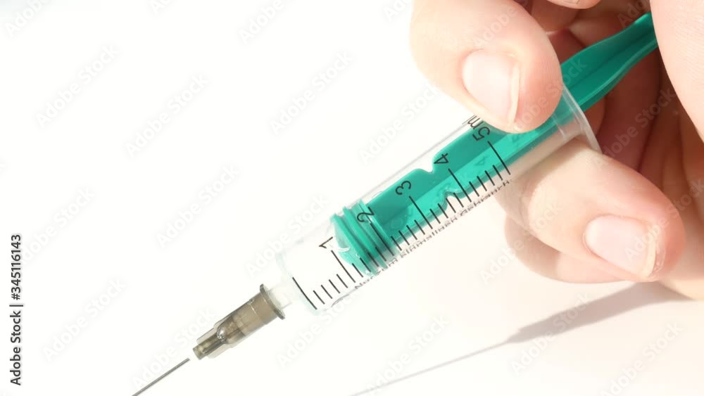Shot of syringe during injection, drug addiction problem, aids epidemic Shot of syringe during injection, drug addiction problem, aids epidemic