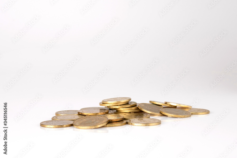 Thai coins stacked on a white background. Financial concepts, investing and saving Thai coins stacked on a white background. Financial concepts, investing and saving