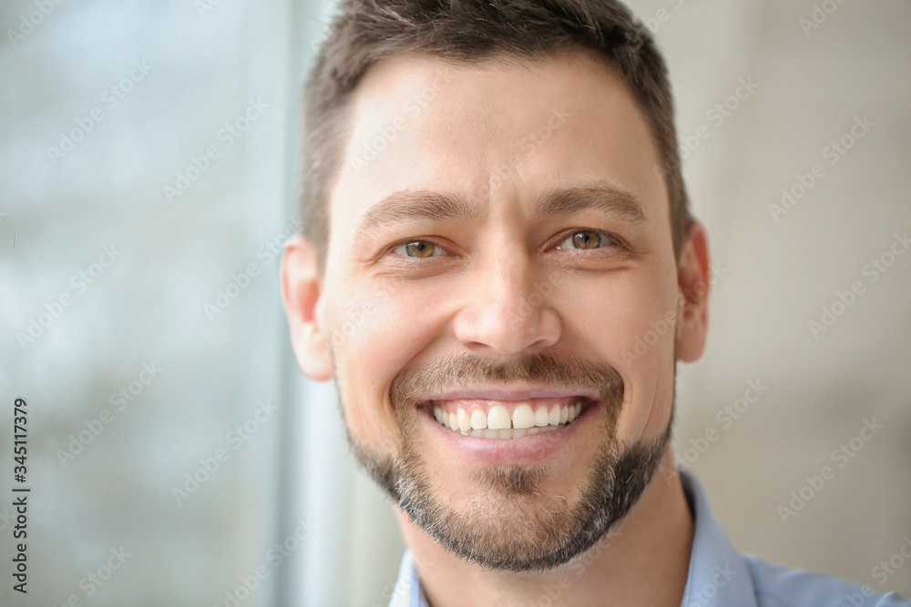 Fototapeta premium Portrait of handsome businessman in office