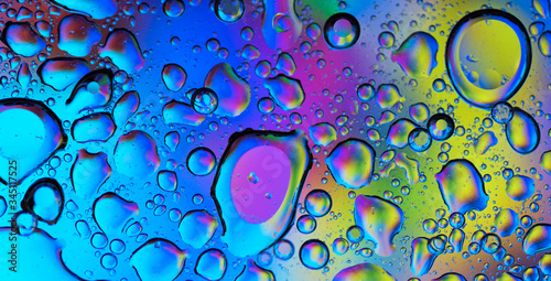 A happy colorful background filled by water drops.