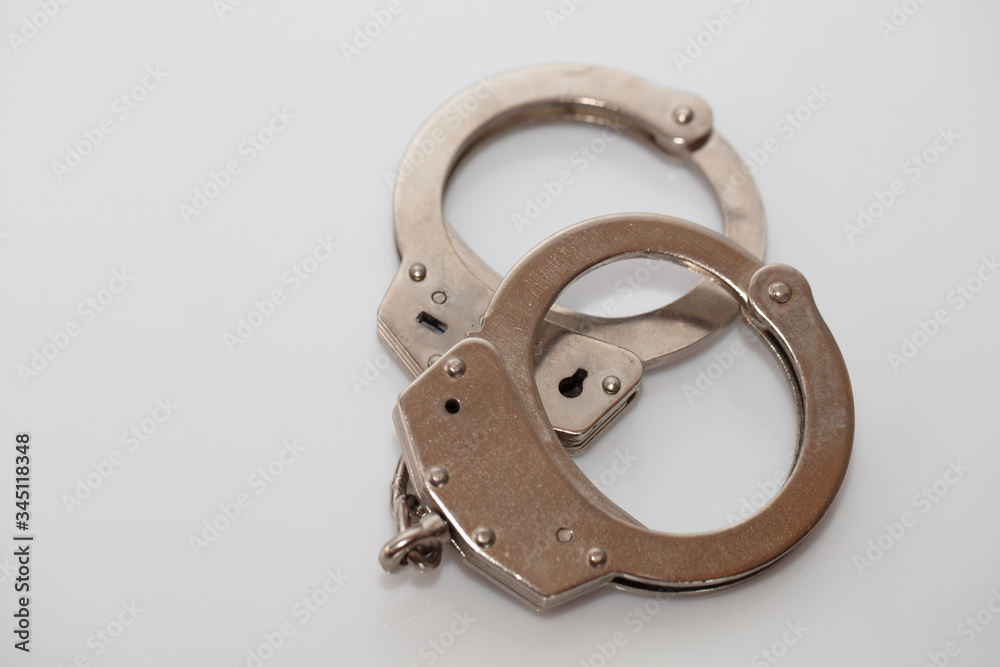 steel metal Handcuffs on white background isolate steel metal Handcuffs on white background isolate
