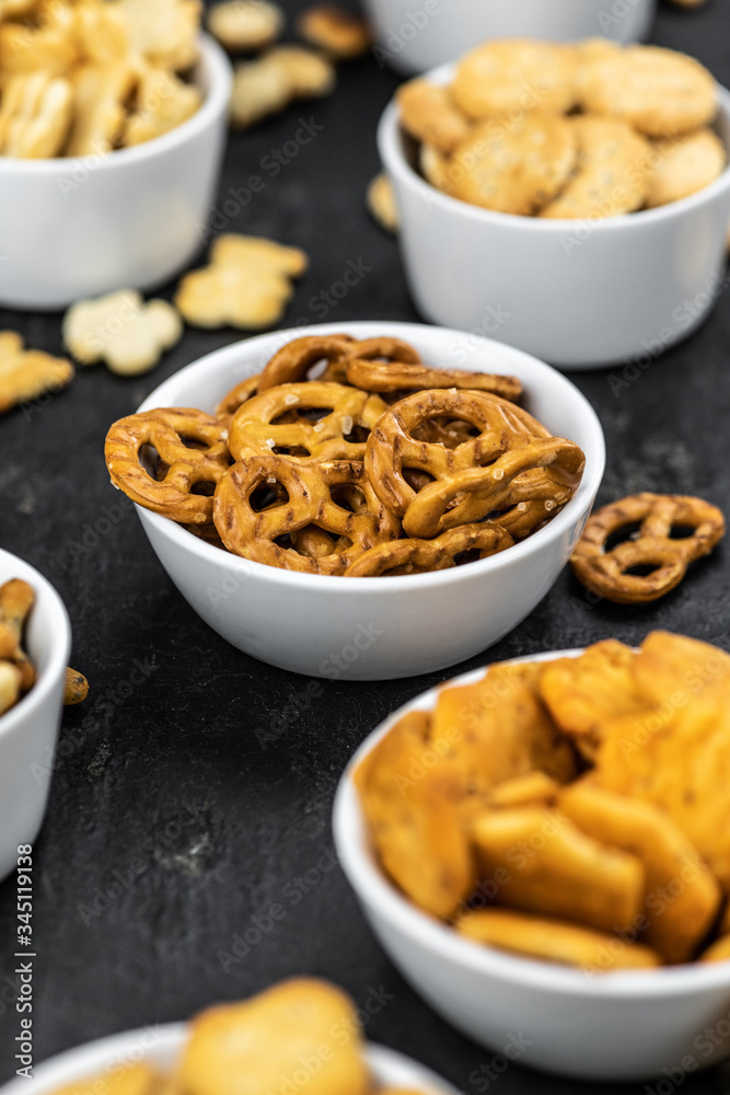 Mixed Snacks on dark background (close up shot; selective focus) Mixed Snacks on dark background (close up shot; selective focus)