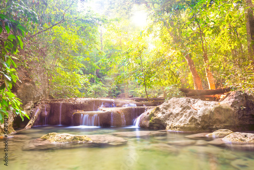 Tropical landscape with beautiful cascades of waterfall and green trees in wild jungle forest. Erawan National park  Kanchanaburi  Thailand
