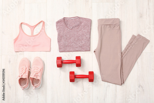 фотографія Composition with sportswear on wooden background