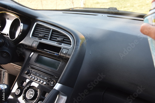 Cleaning Car Interior And Spraying With Liquid. © Miroslav110