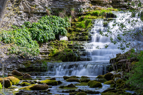Mossy stones with waterfall background