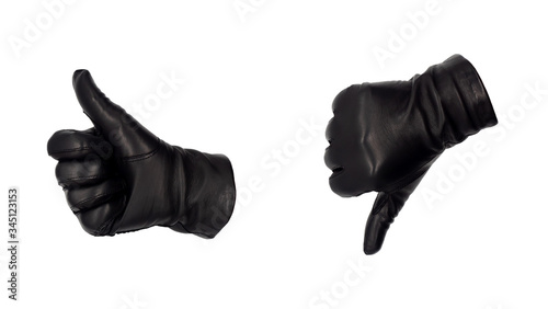 Hands wearing black leather gloves make the thumbs up and down  gesture, view from front and back.  Approval or disapproval judgement. Female hand isolated, no skin