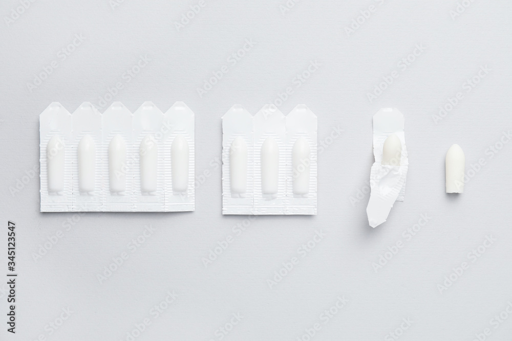 Hemorrhoidal suppositories on light background Hemorrhoidal suppositories on light background