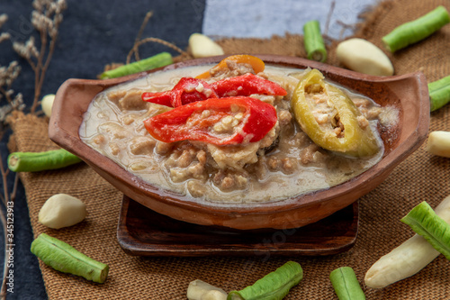 Soya Bean dipping sauce with pork in coconut milk dip (Tow Jieow Lon or Lon Taochiao). photo