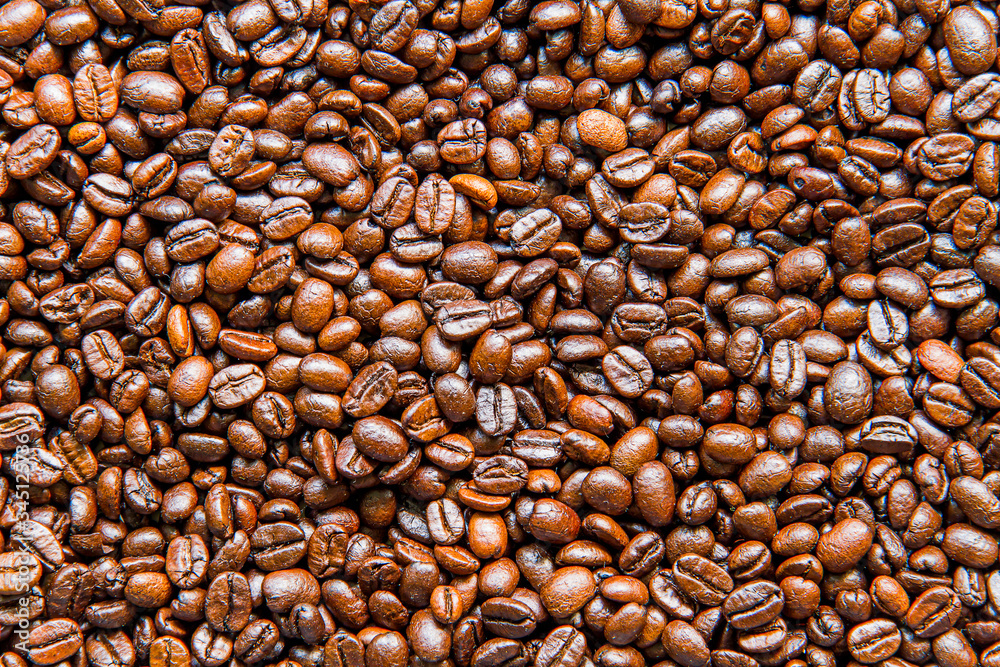 Dark roasted coffee beans background