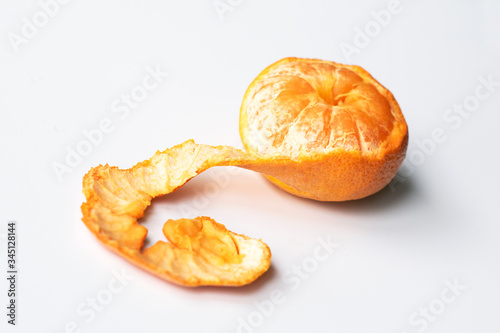 peeled tangerine isolated on white background