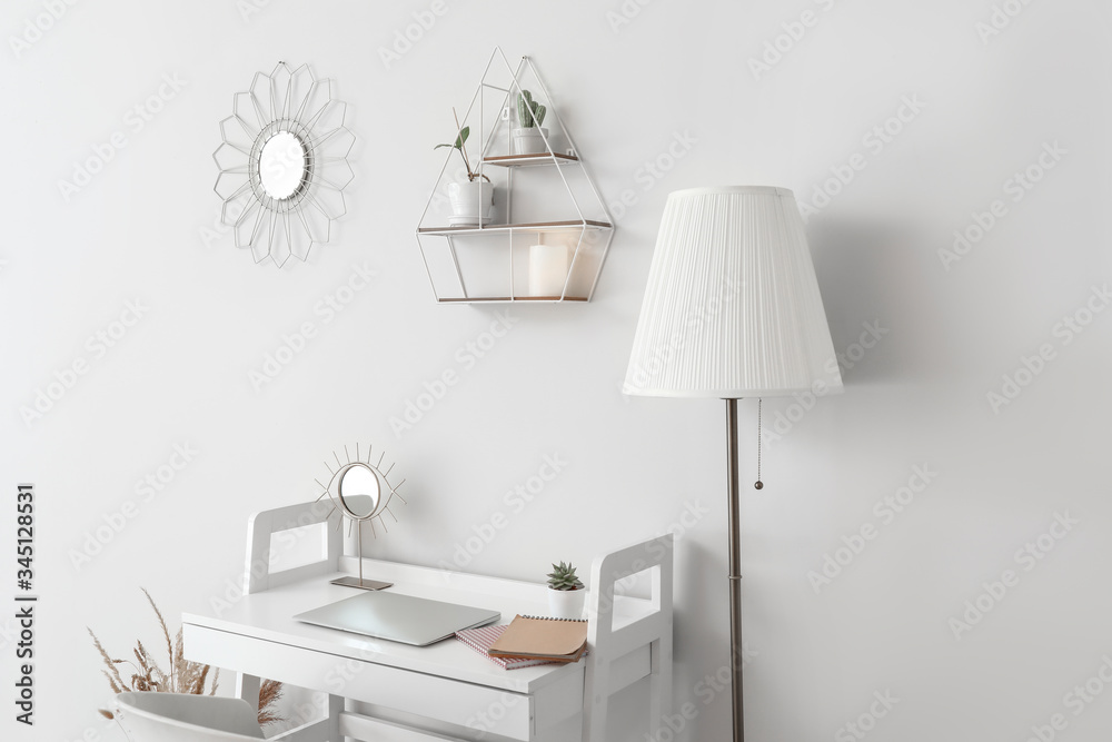Fototapeta premium Stylish workplace near white wall in room