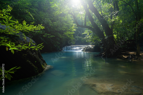 Beautiful waterfall in deep forest at National Park, Thailand. © yotrakbutda