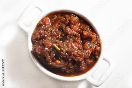 Traditional Turkish appetizer meze - Acili ezme, Chili hot peppers photo