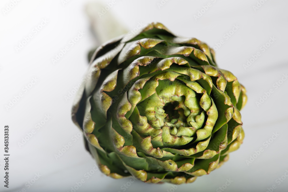 Obraz premium Close-up of fresh artichoke on white background