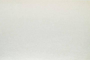 A dense industrial sheet of grey paper with a textured surface
