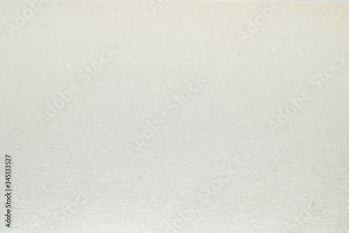 A dense industrial sheet of grey paper with a textured surface