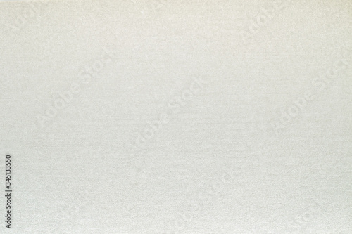 A dense industrial sheet of grey paper with a textured surface