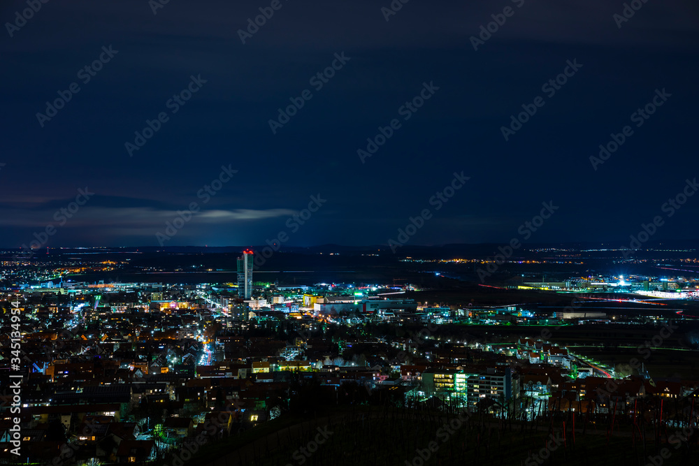 Germany, Dark night atmosphere over fellbach city skyline, aerial view above the houses by night Germany, Dark night atmosphere over fellbach city skyline, aerial view above the houses by night