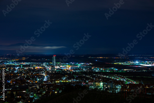 Germany, Dark night atmosphere over fellbach city skyline, aerial view above the houses by night