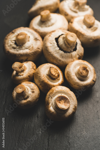 Freshly harvested mushrooms on the rustic wooden background. Selective focus. Shallow depth of field.
