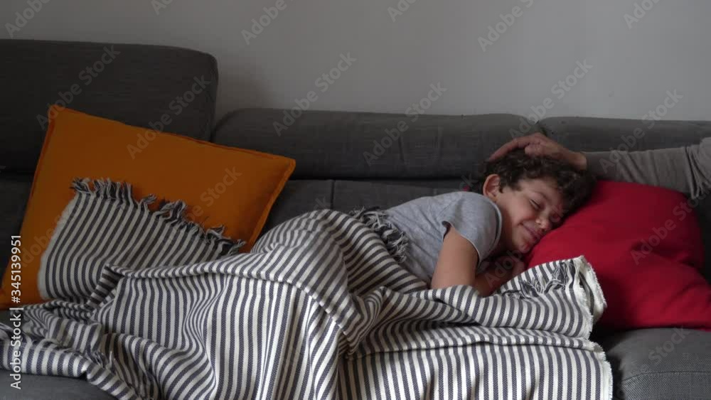 Europe, Italy , Milan -  children boy  five years with mask at home during quarantine at home due covid19 Coronavirus outbreak - life style in apartment - wake up to go to school , breakfast time 