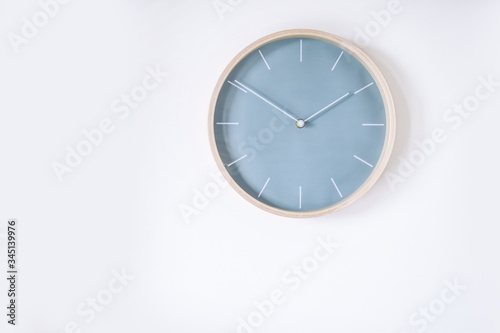 pastel blue wall clock isolated on white