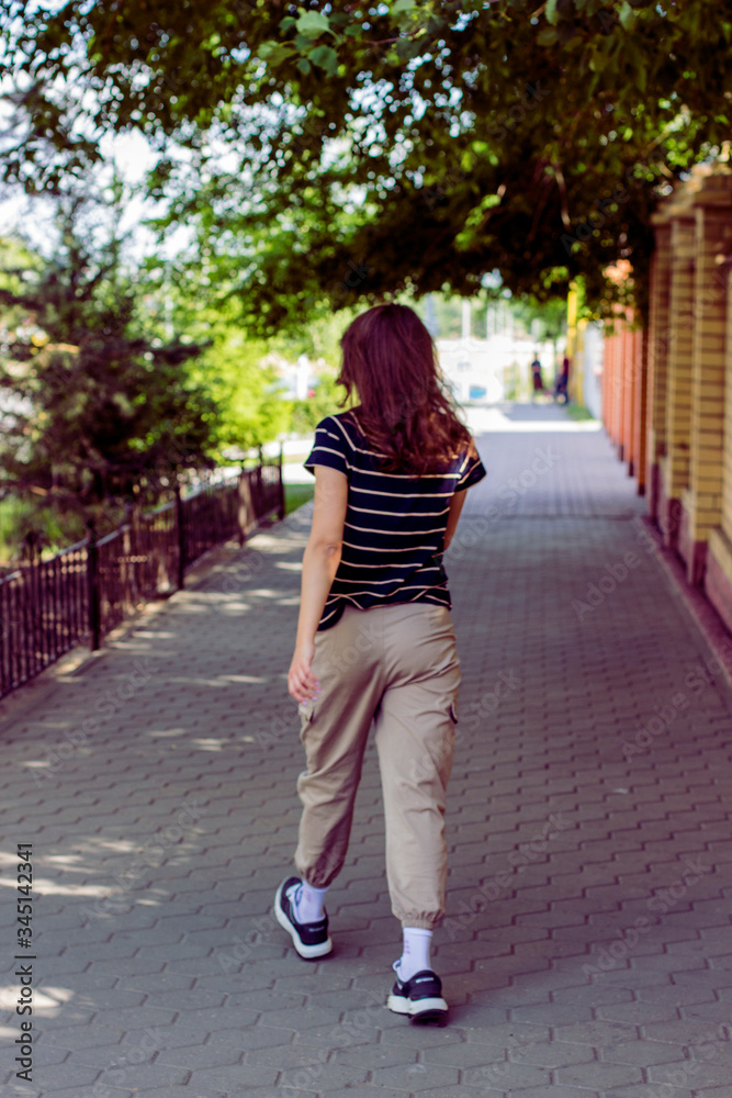 Cool girl walking on the streets of city Cool girl walking on the streets of city