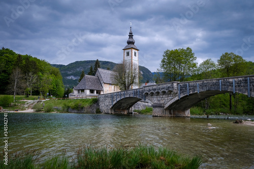 St John The Baptist Church beside bridge and Bohinj lake