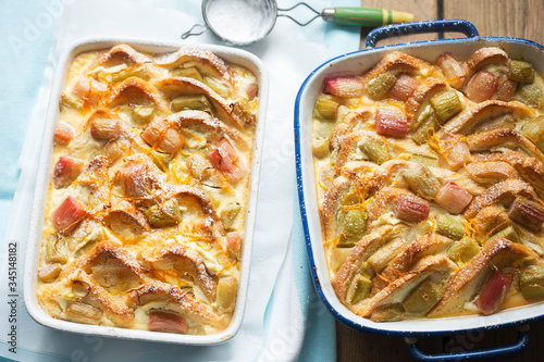 Rhubarb & ricotta bread & butter pudding with icing sugar  photo