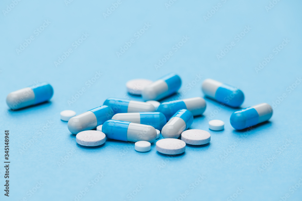 medicine tablets vitamins on the table in the group