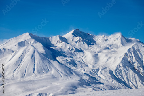 Snowy peaks of Georgian mountains in winter at a ski resort
