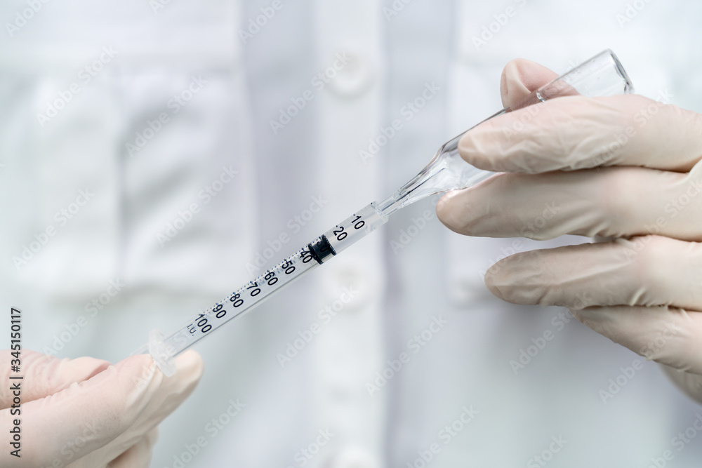 nurse holding a syringe with a vaccine nurse holding a syringe with a vaccine