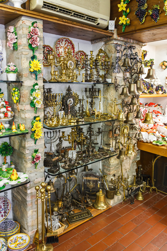 The showcase of a souvenir shop selling decorative items made of copper and other metals in the Sirmione town in Lombardy, northern Italy