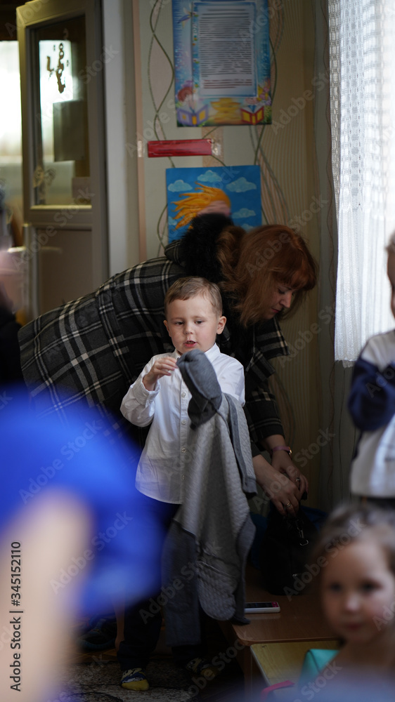 A boy in white shirt prepares for a kiddy party A boy in white shirt prepares for a kiddy party
