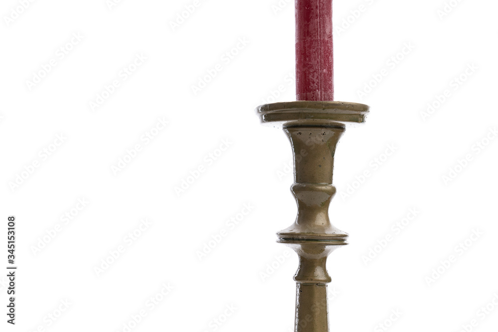 Cropped image of a retro candlestick with red candle isolated on white background Cropped image of a retro candlestick with red candle isolated on white background