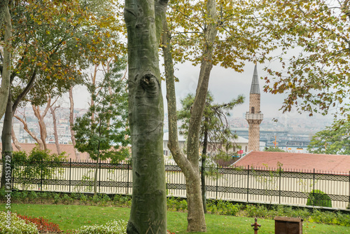 ISTANBUL, TURKEY: The view from Gulhane Park to the city: the minaret of the mosque, Galat tower, the house flag of Turkey photo