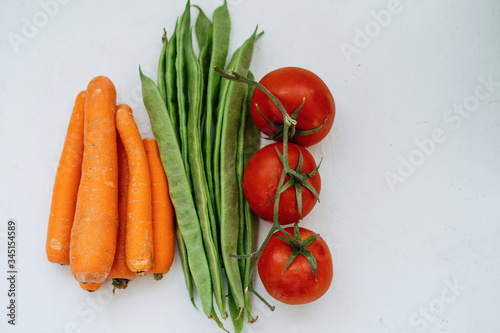 Pile Of Carrots, Tomatoes And Green Beans