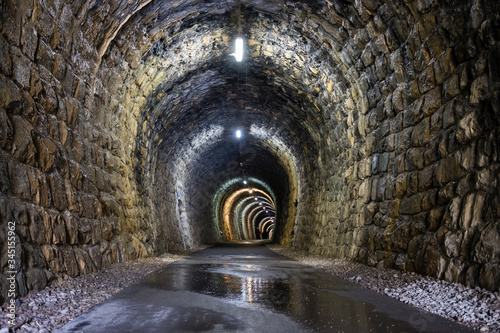 beautifully lit tunnel of Parenzana railway in Strunjan, Slovenia