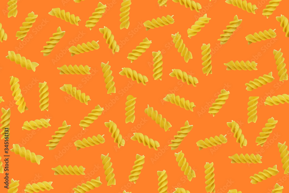 Yellow pasta pattern on orange  background. Food background.