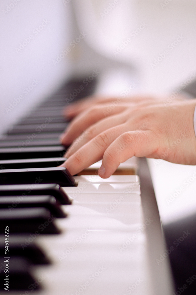 Fototapeta premium a man playing the piano