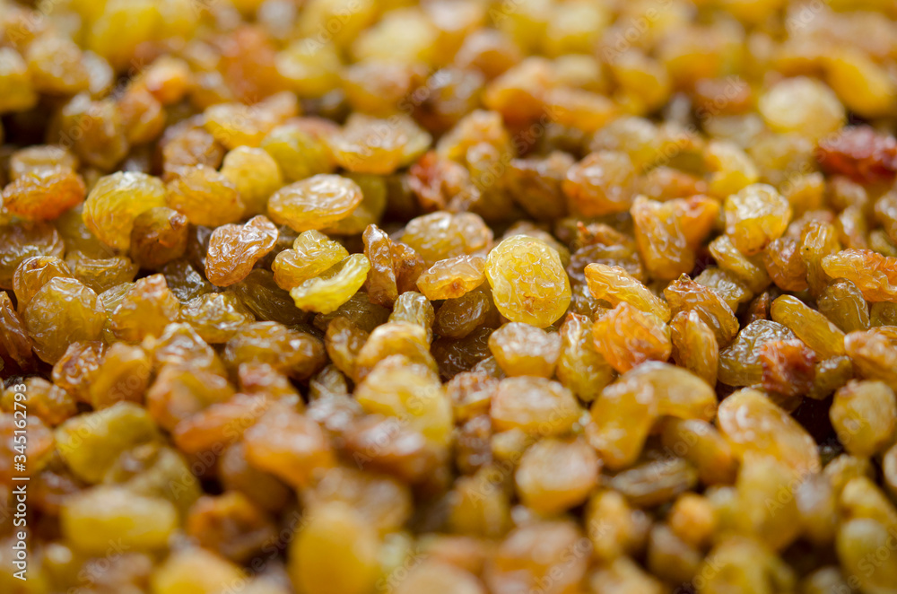 Raisins close up. Dry grapes. Dried fruits for healthy food, dessert substitute Raisins close up. Dry grapes. Dried fruits for healthy food, dessert substitute