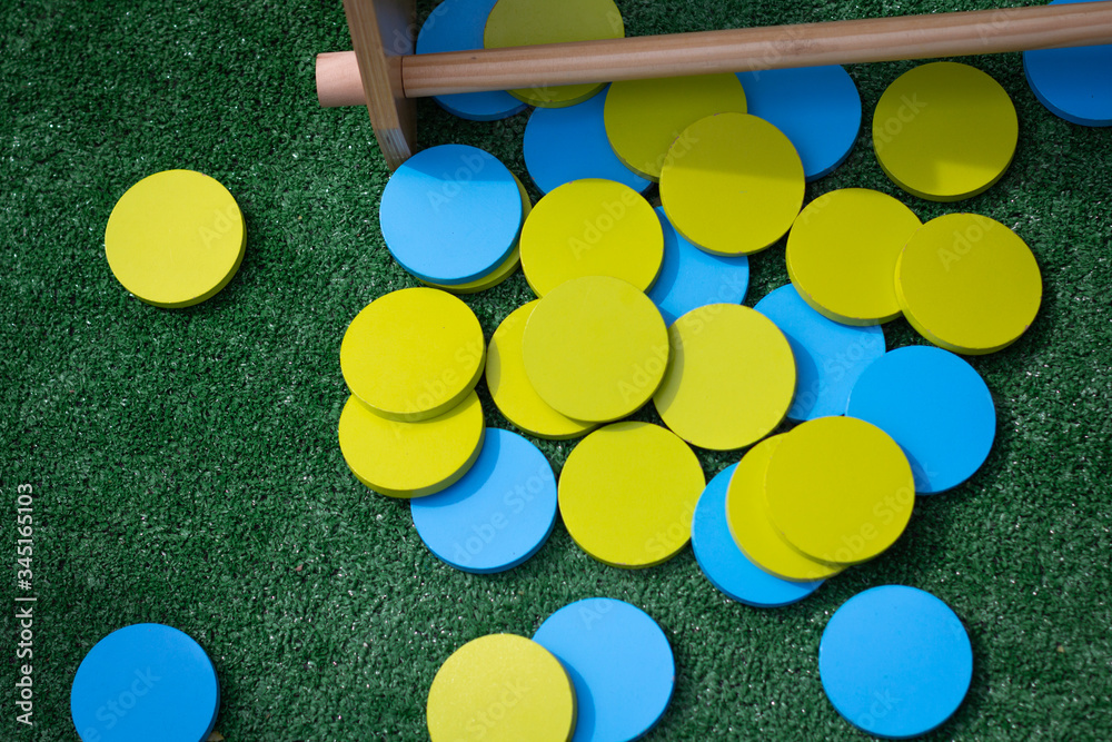 Colorful Toy Chips on Green Background