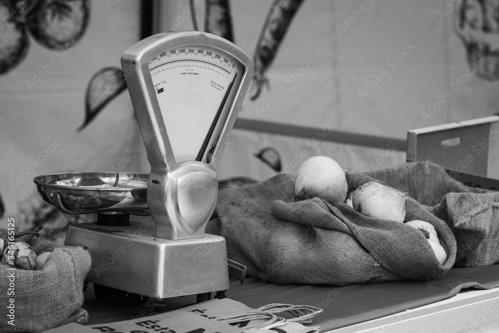 Black and White Photo of Scale and Vegetable
