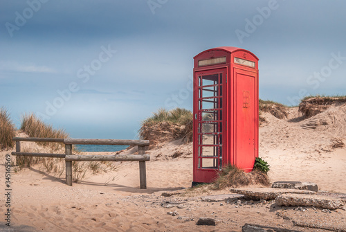 Obraz na płótnie The iconic and weathered red telephone box on Shell Bay beach, Studland, near Sandbanks, Dorset, UK w salonie