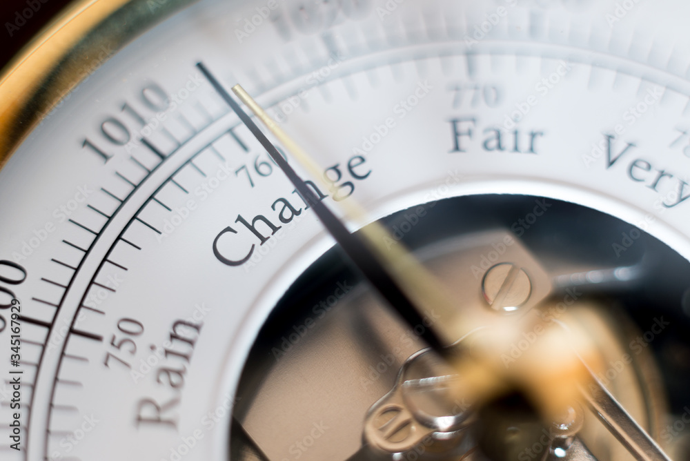 needle of a barometer pointing at the word change. close up of the word needle of a barometer pointing at the word change. close up of the word