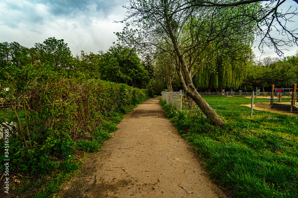 Path in the park at Rusalka lake in Poznan (Posen), Poland