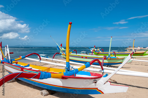 Fototapeta Naklejka Na Ścianę i Meble -  Jukung fishing boats on beach at Sanur Bali Indonesia