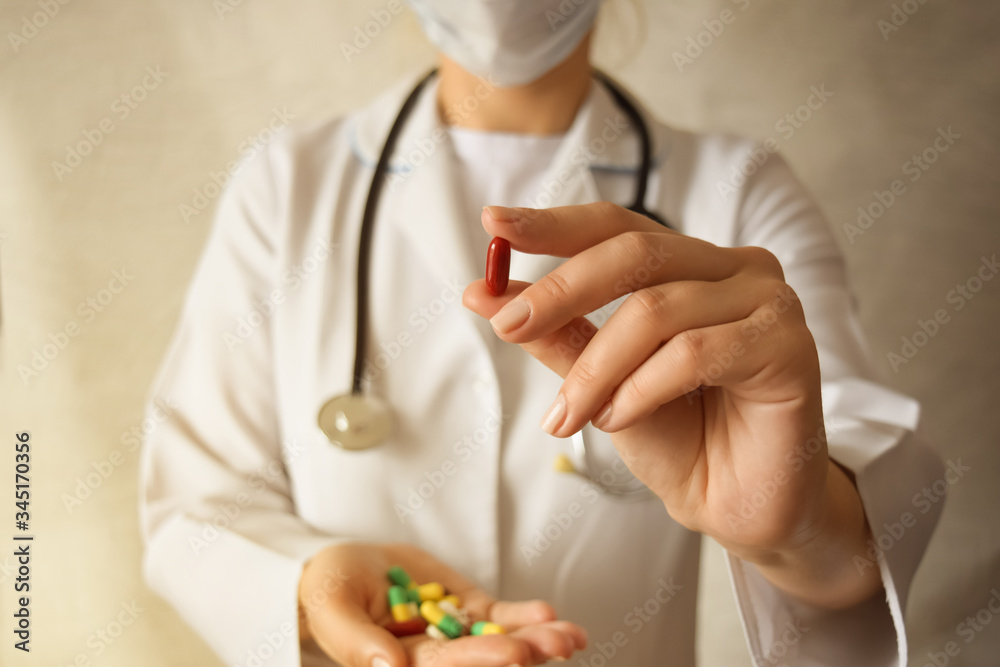 Medicine pills or capsules in hand, palm or fingers.