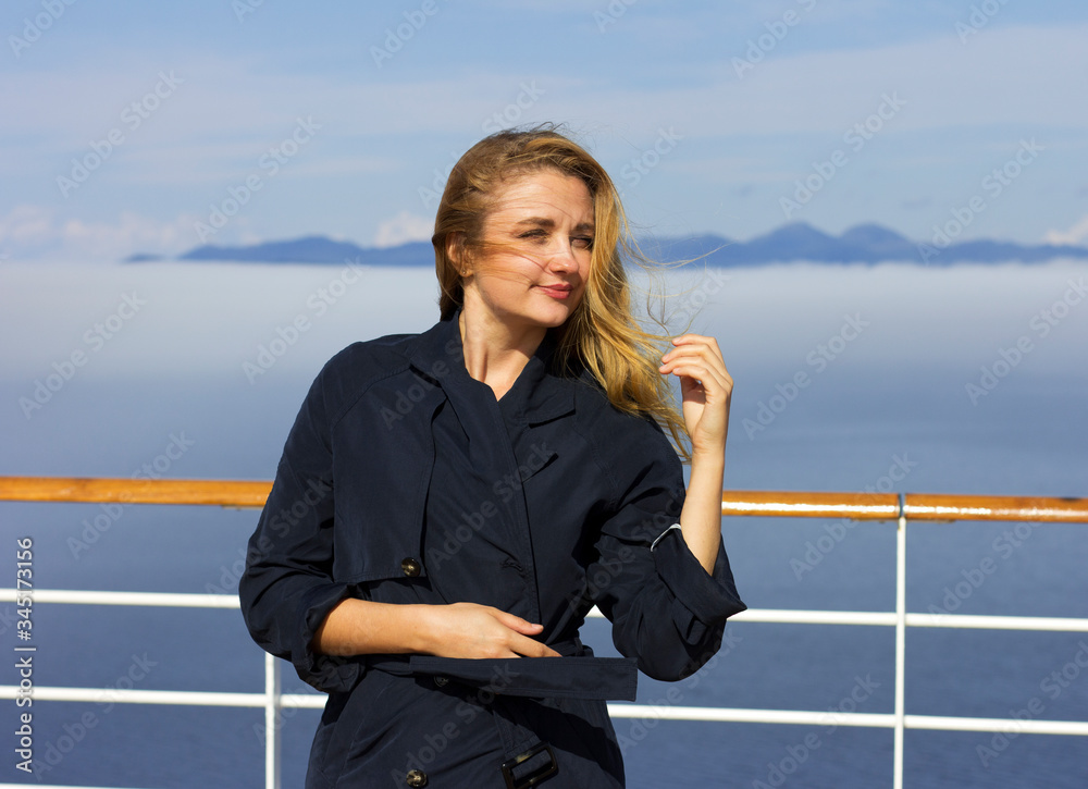Young beautiful girl enjoys the fresh air. Woman on vacation. Young beautiful girl enjoys the fresh air. Woman on vacation.
